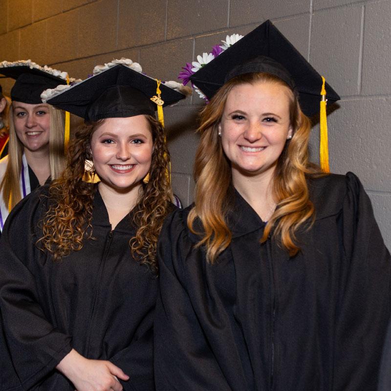 UE grads in regalia at graduation